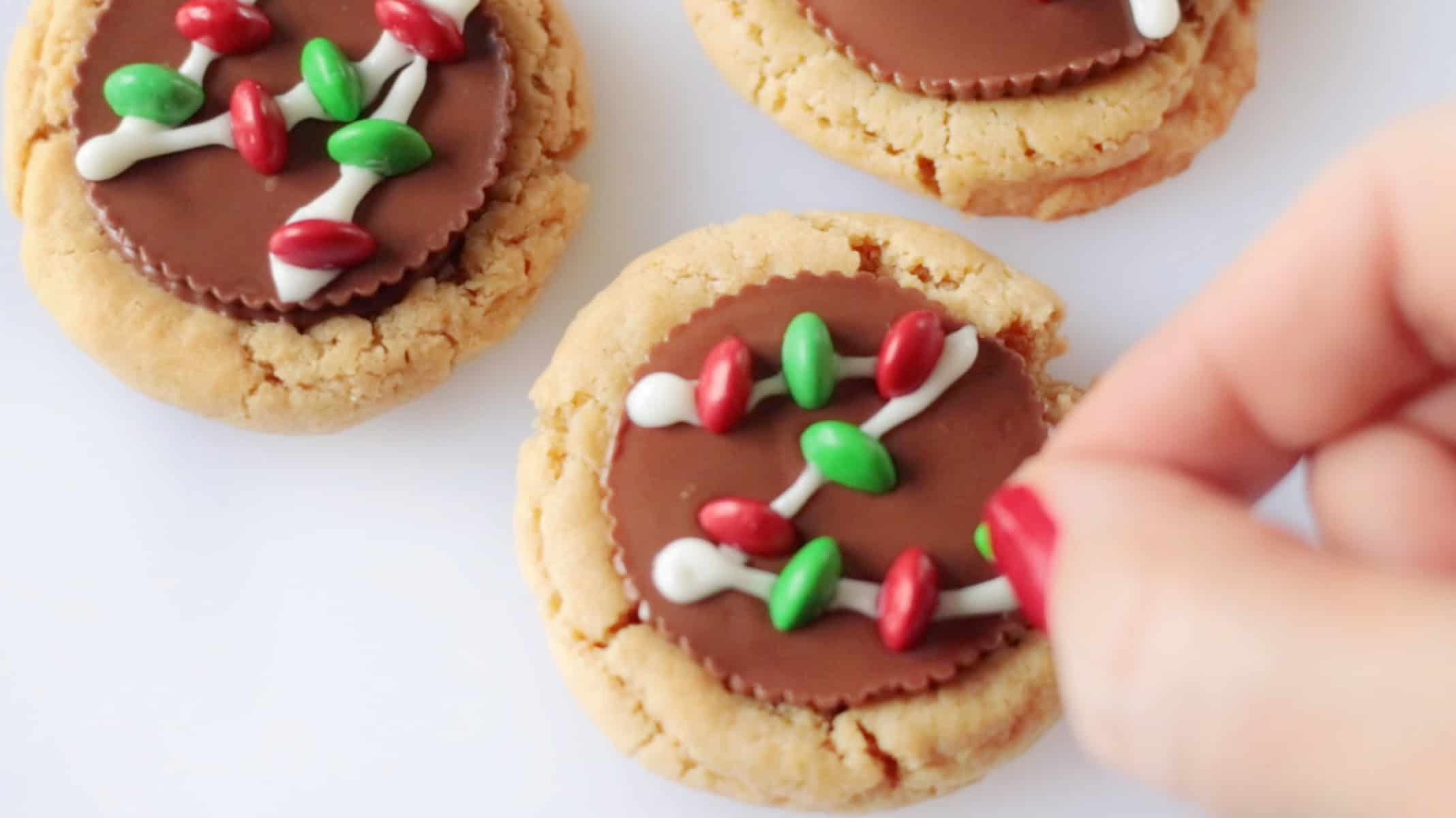 Christmas light decorated peanut butter cup cookies.