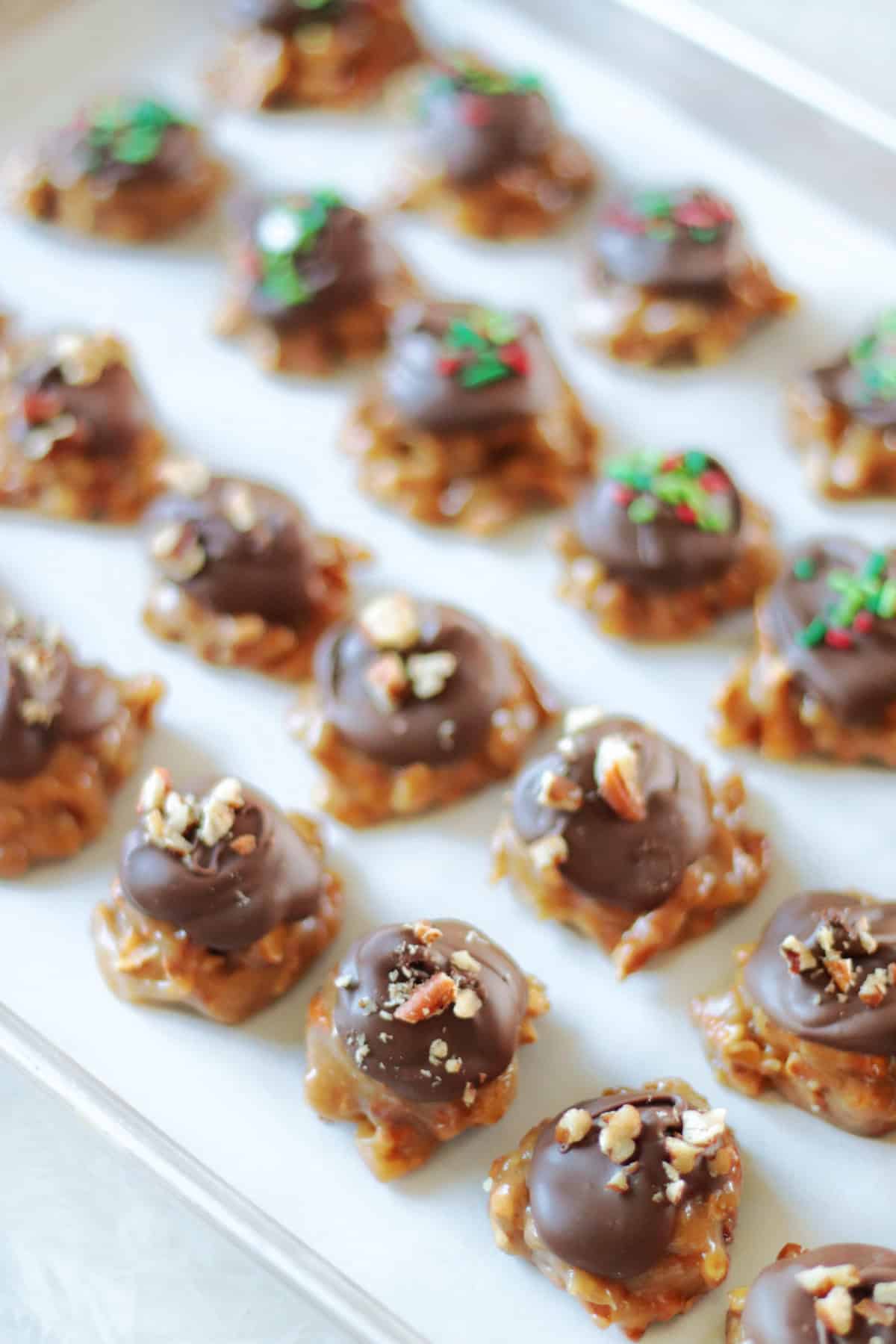 Peanut butter pretzel clusters on baking sheet.