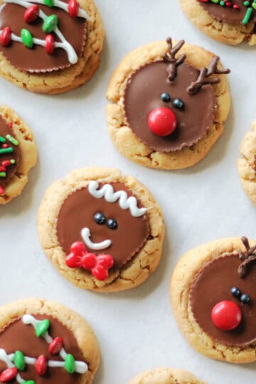 Holiday peanut butter cup cookies on parchment paper.