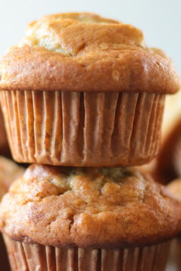 Two banana nut muffins stacked on top of eachother.