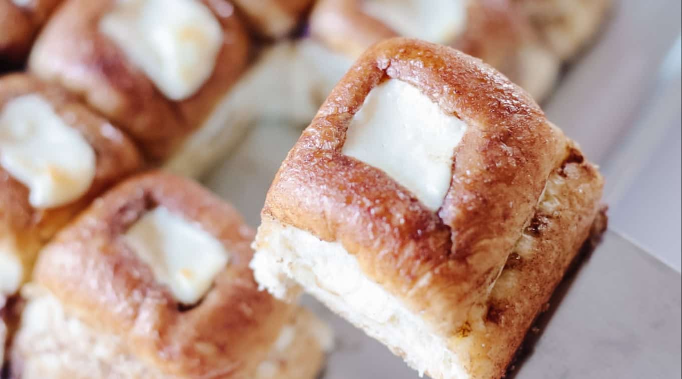 Spatula with Hawaiian cheesecake roll on top.