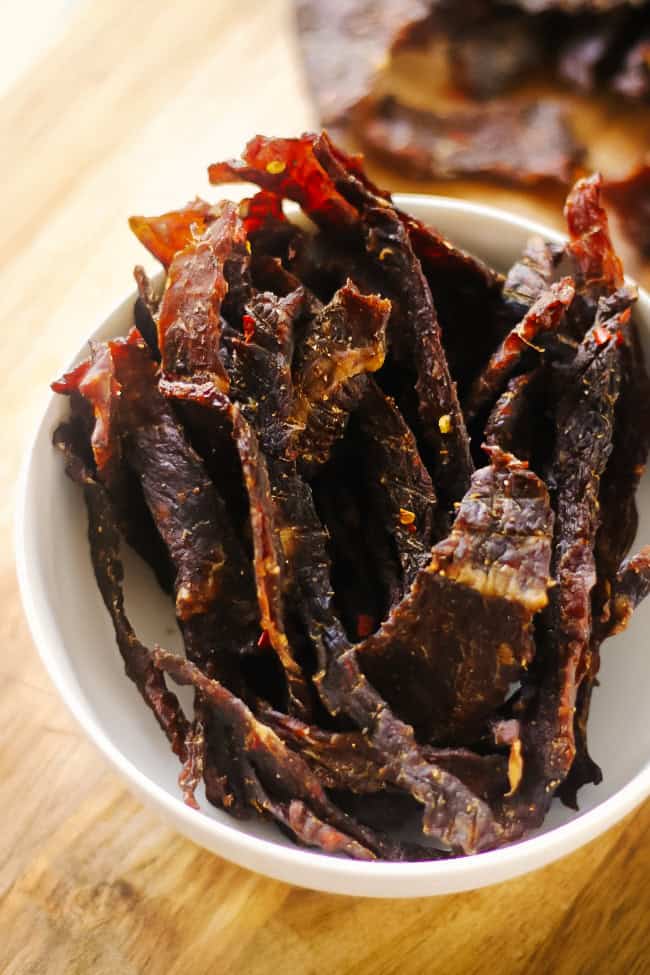 Sweet and spicy jerky in a white bowl.