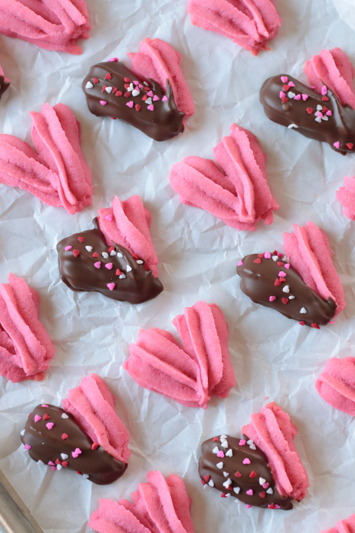 Heart shaped butter cookies dipped in chocolate.