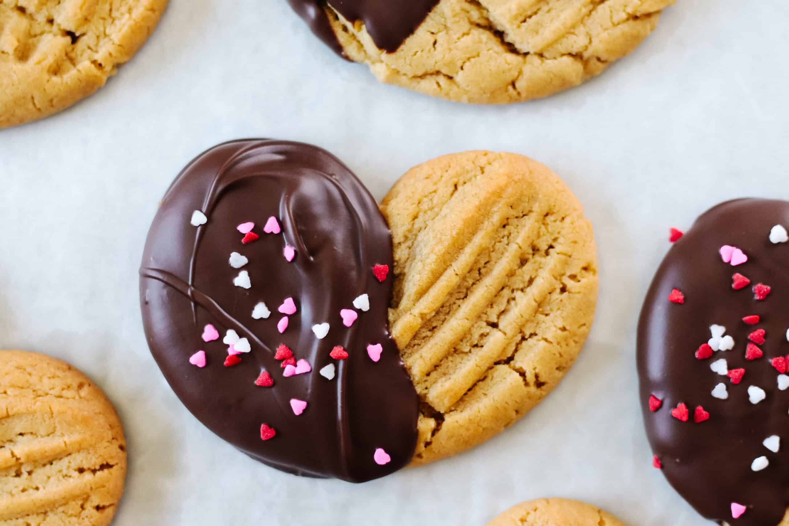 Heart shaped peanut butter cookies dipped in chocolate.