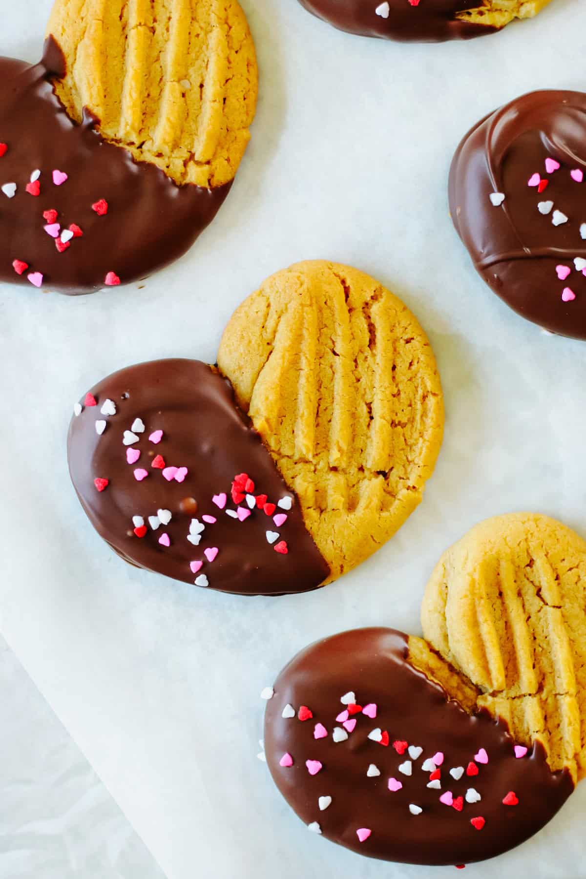 Heart shaped peanut butter cookies dipped in chocolate.