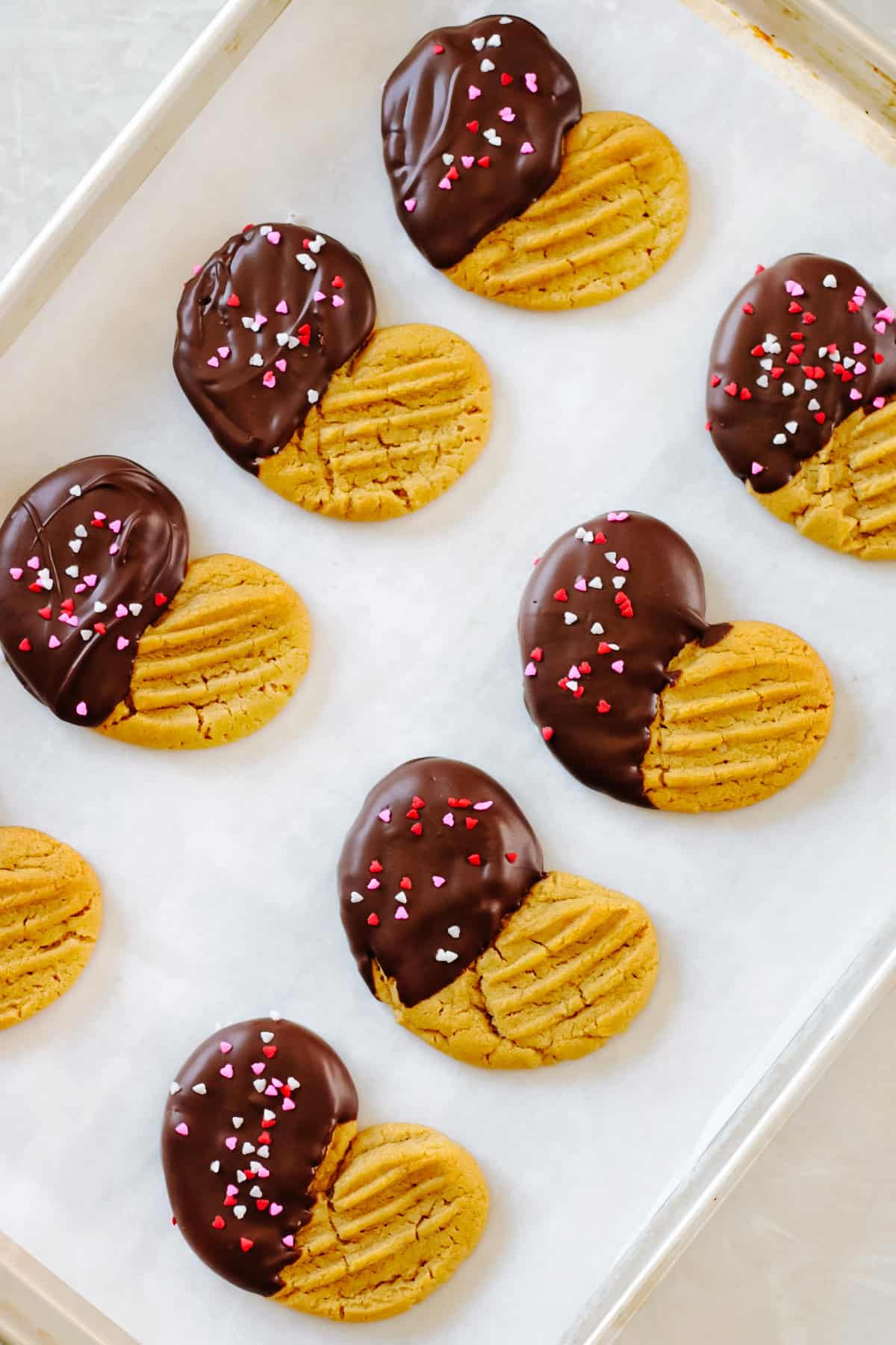Heart shaped peanut butter cookies dipped in chocolate.