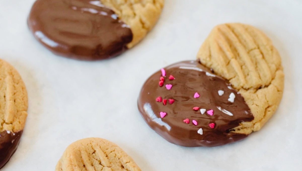 Heart shaped peanut butter cookies dipped in chocolate.