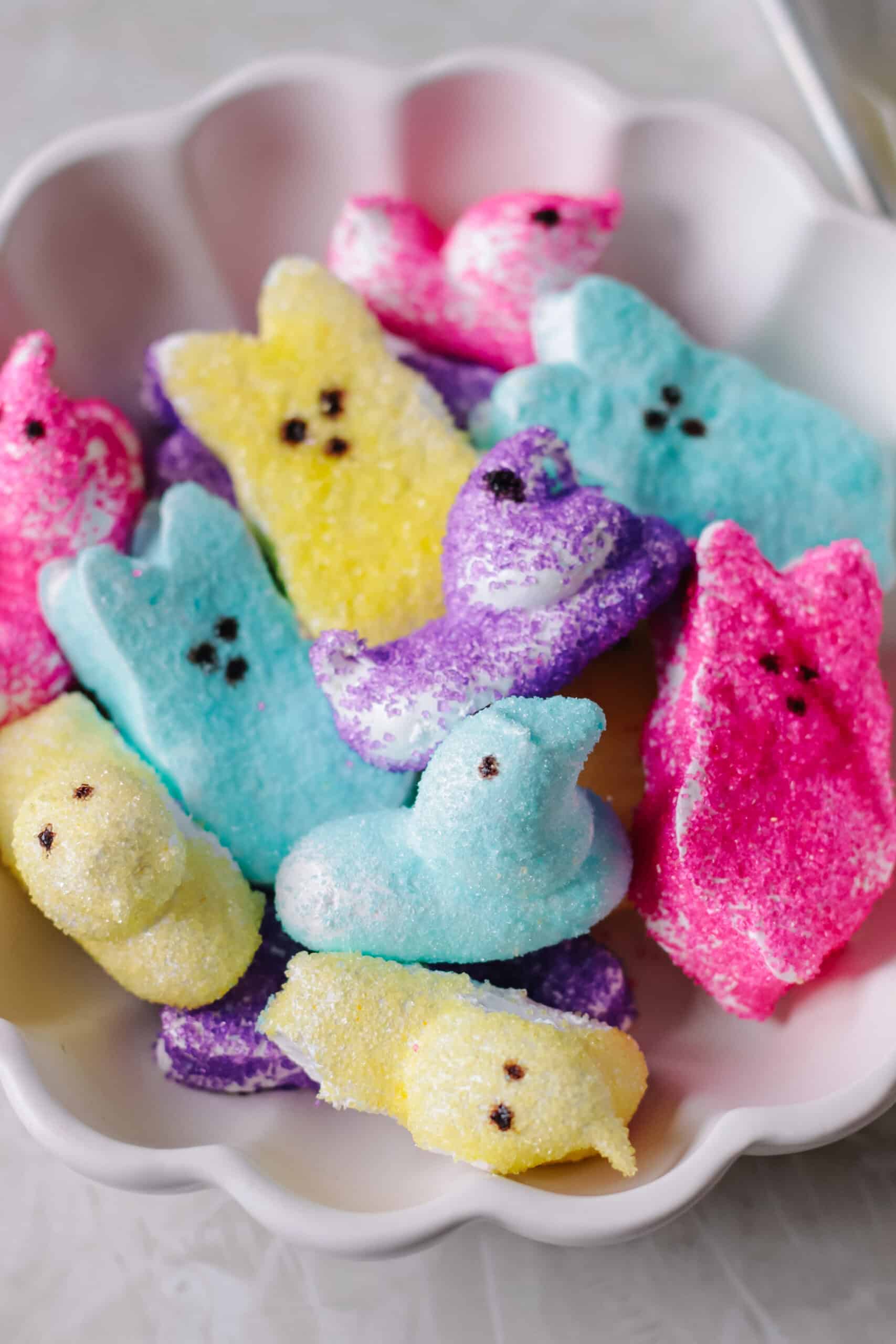 Homemade peeps marshmallows in scalloped dish.