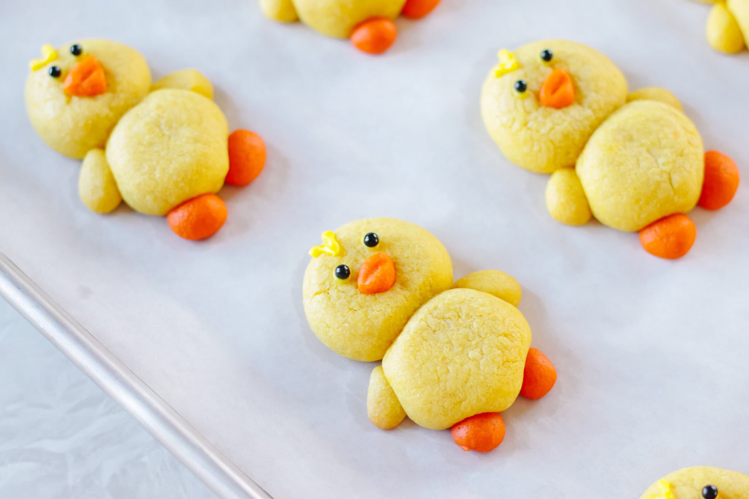 Chick sugar cookies on a baking sheet.