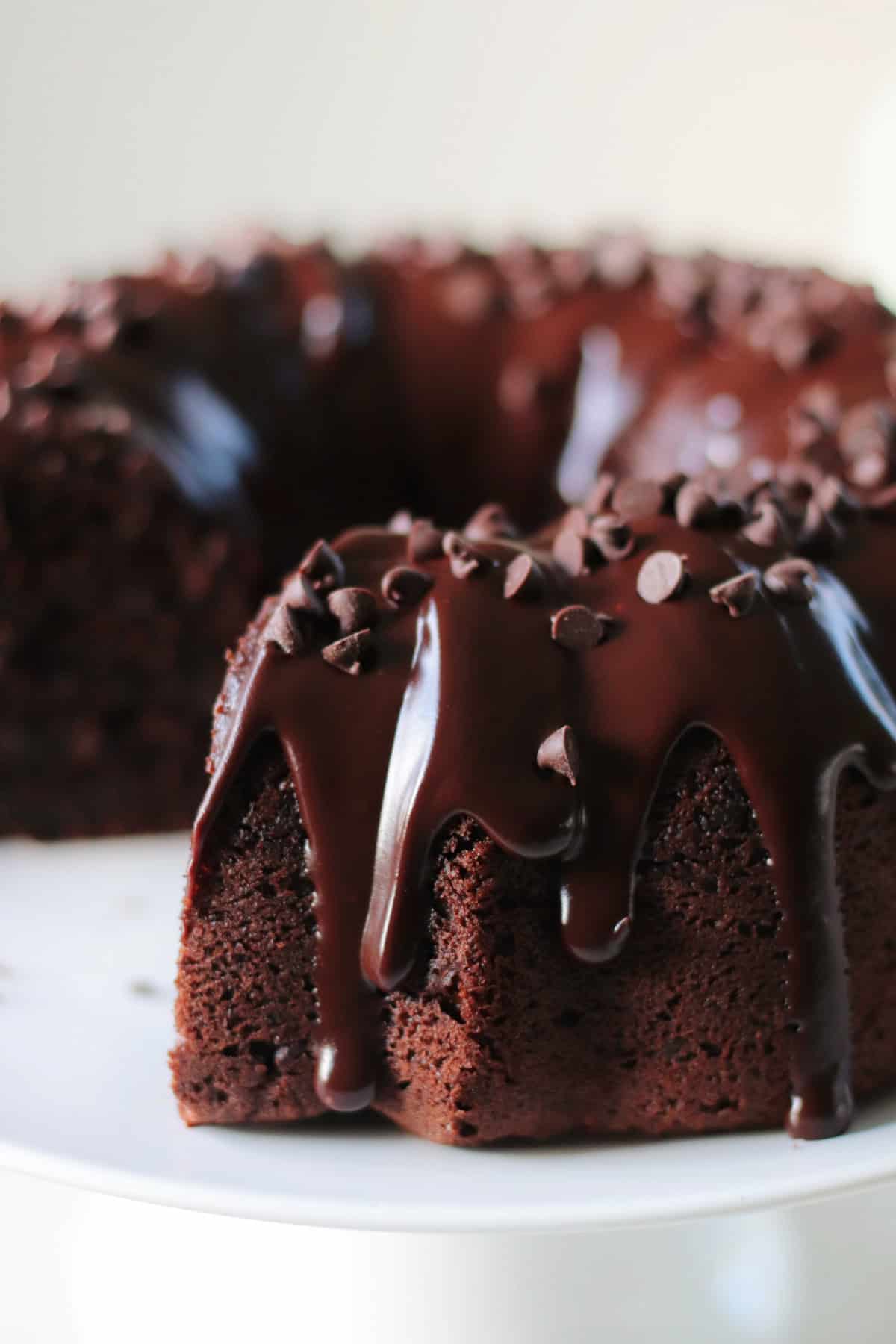 Chocolate bundt cake with slice missing.