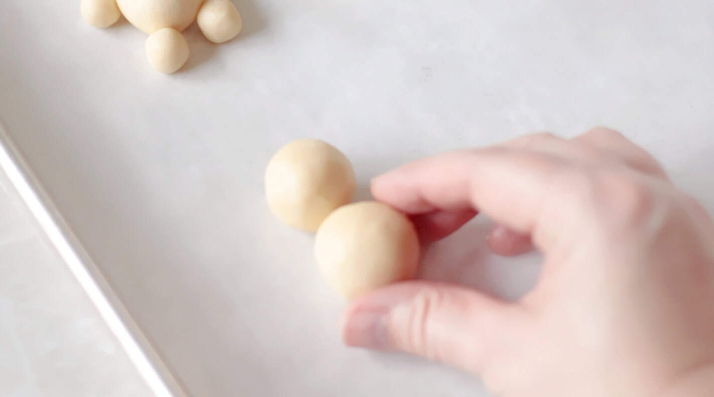 Two cookie dough balls placed next to eachother for bunny body shape.