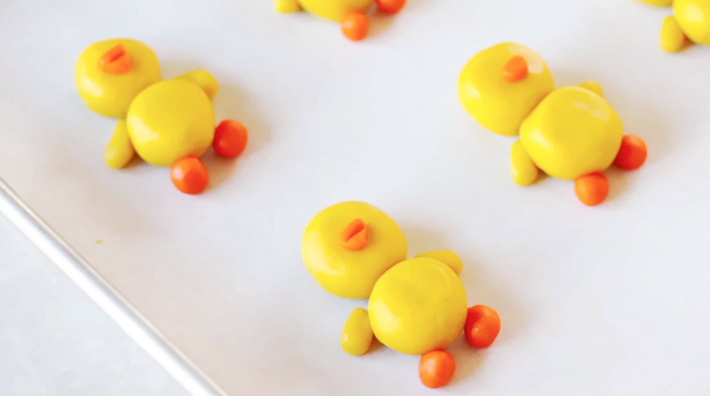 Unbaked sugar cookies on baking sheet.