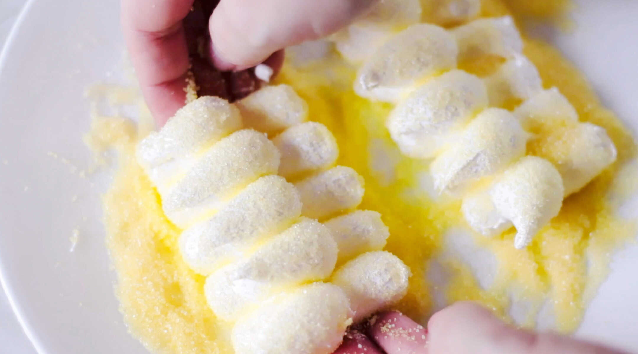 Rows of chick peeps in yellow sugar.