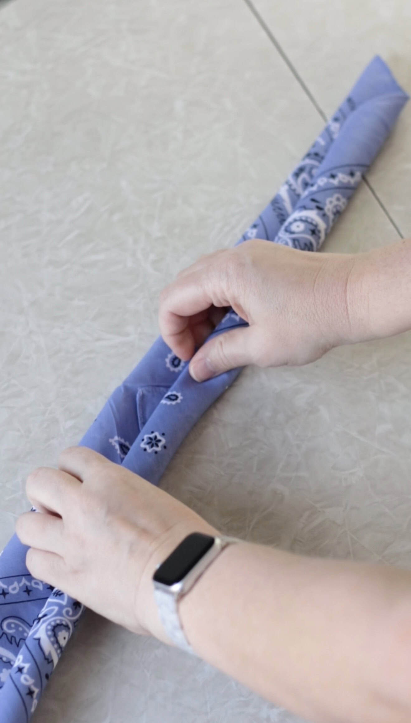 Purple bandana rolled up.