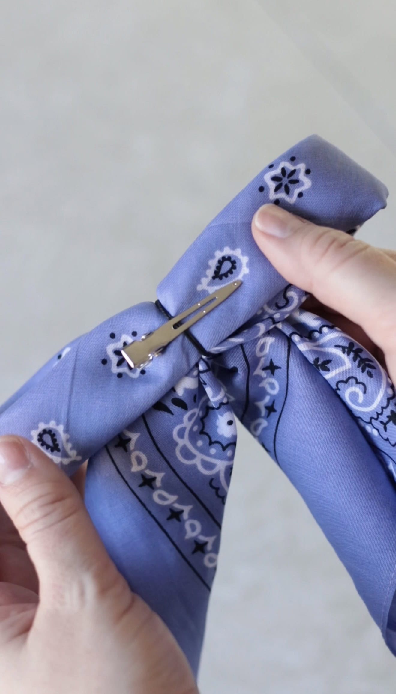 Back of purple bandana hair bow with alligator clip.