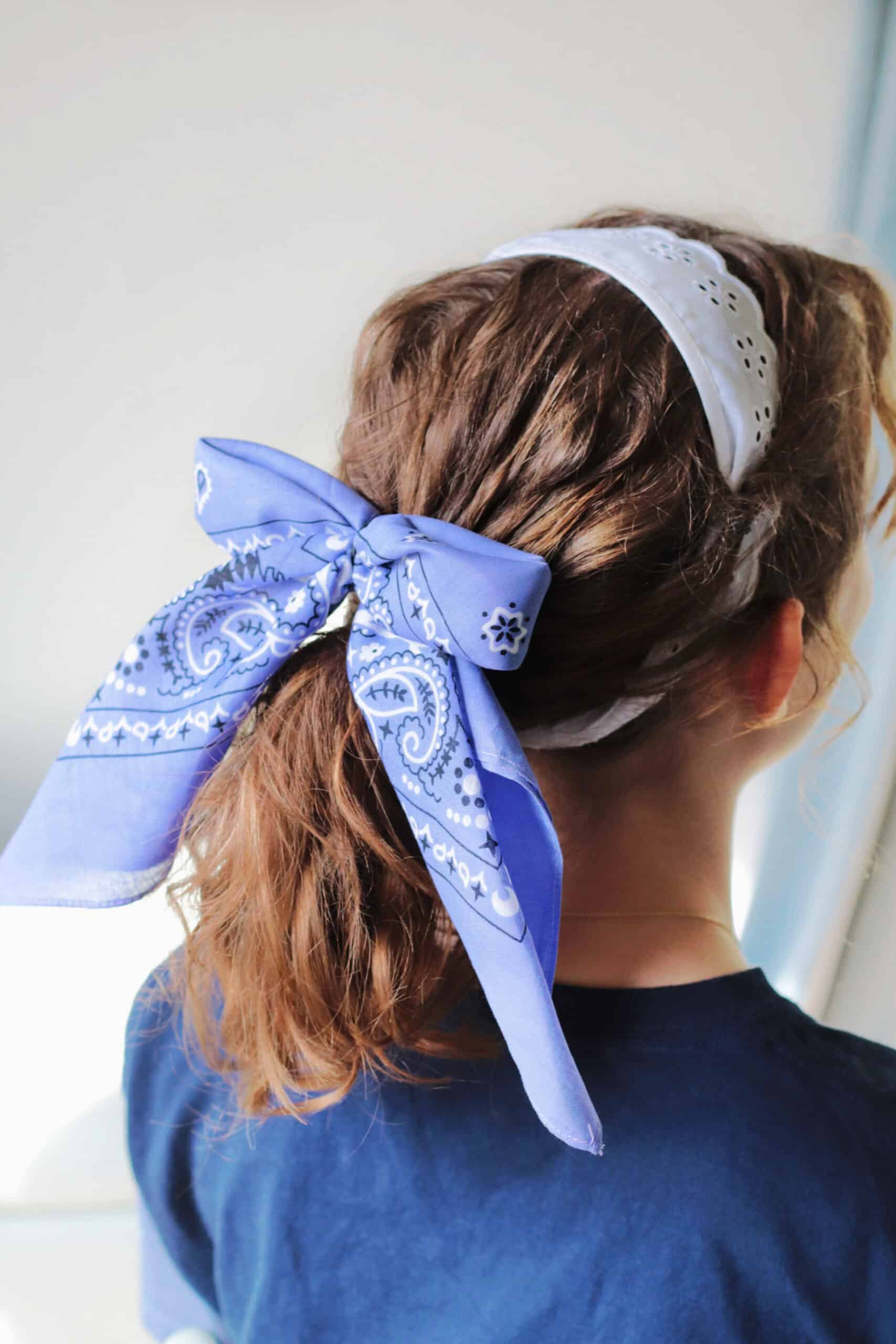 Girl wearing bandana hair clip.