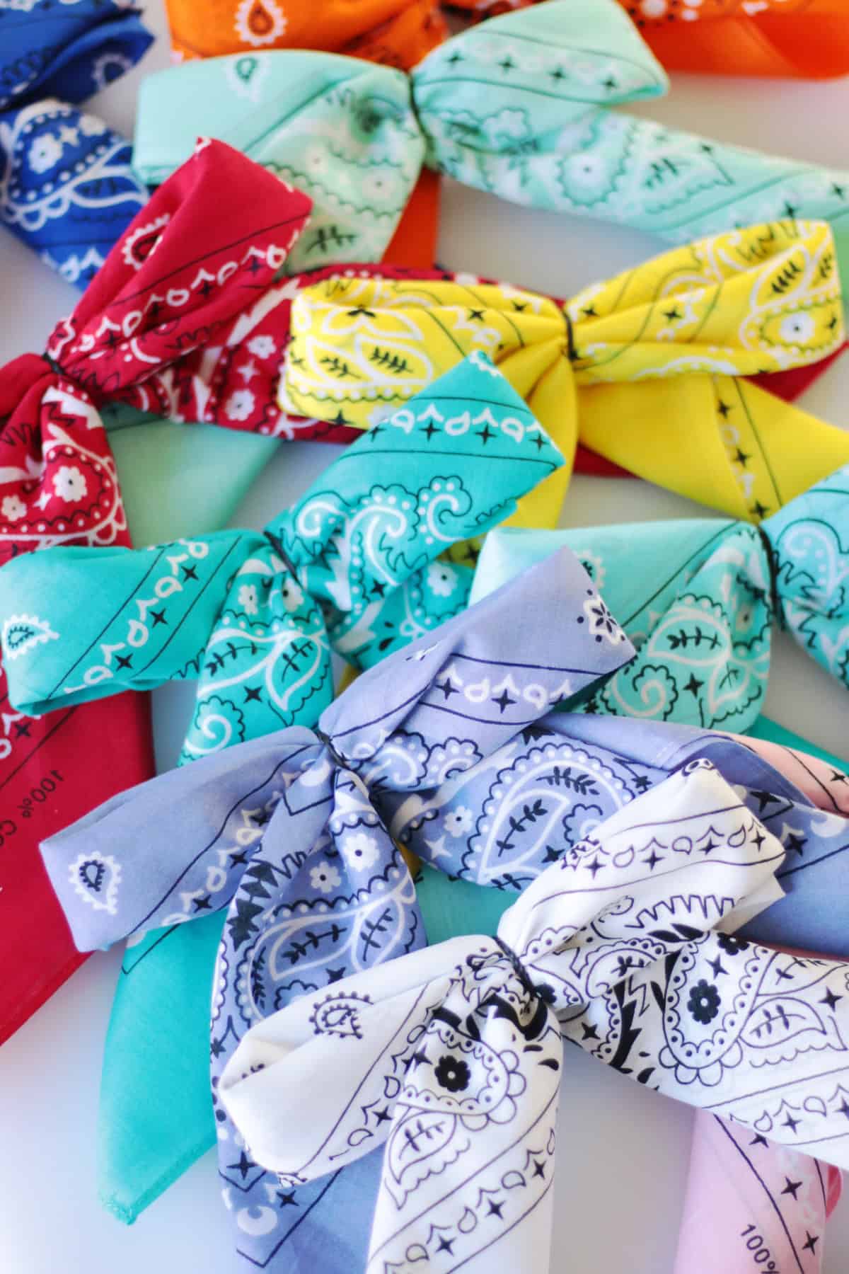 Pile of bandana bows in a variety of colors.