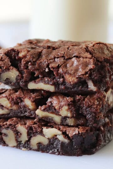 3 walnut brownies stacked.