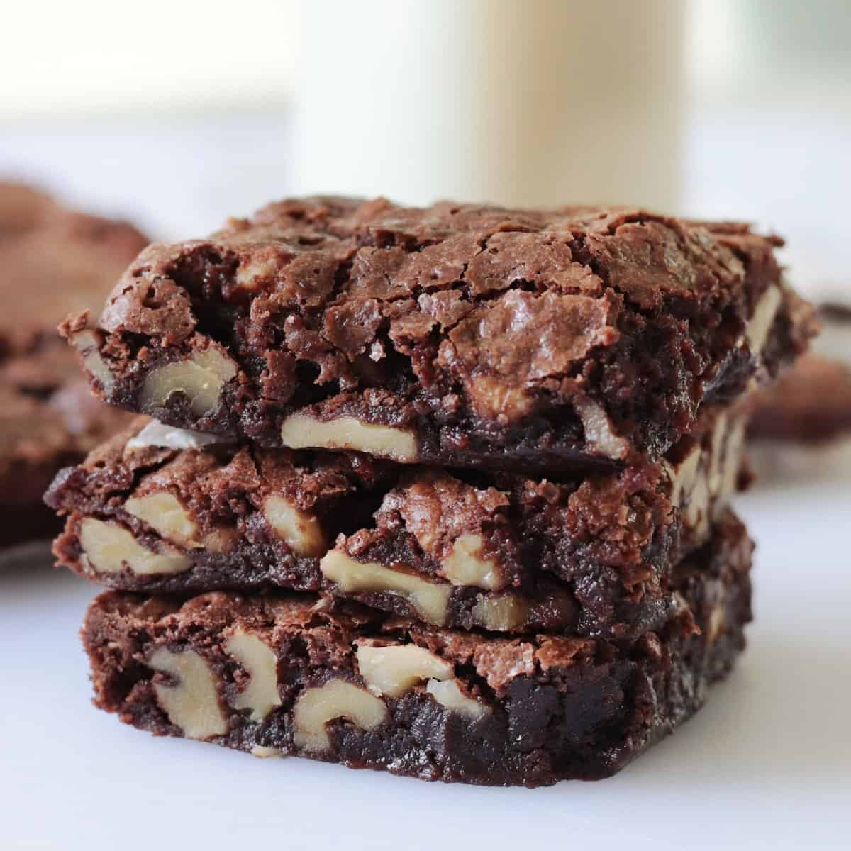 3 walnut brownies stacked.