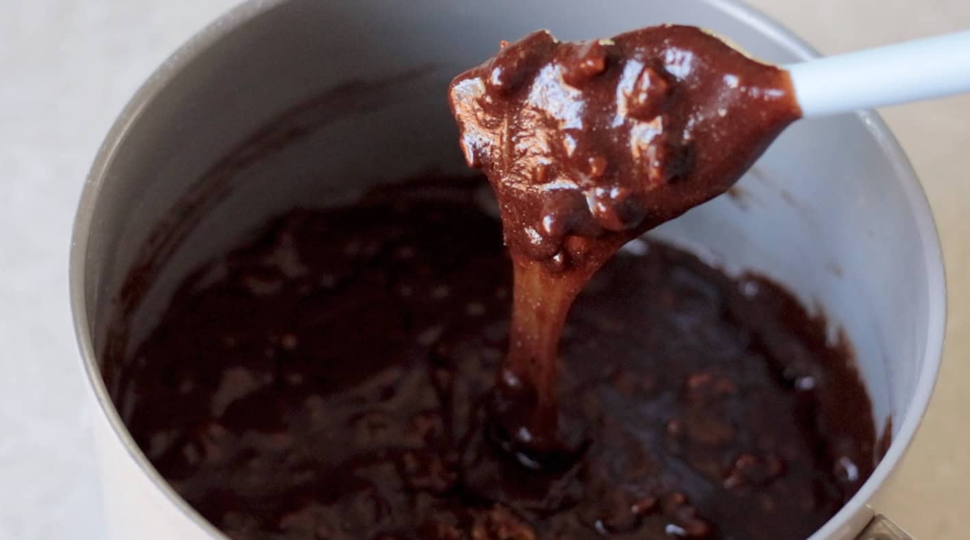 Brownie batter on rubber spatula.