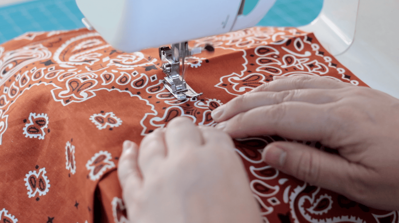 Sewing machine sewing pocket to the bag lining.