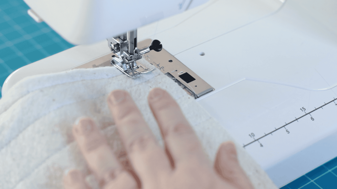 Sewing machine stitching outside of bag.