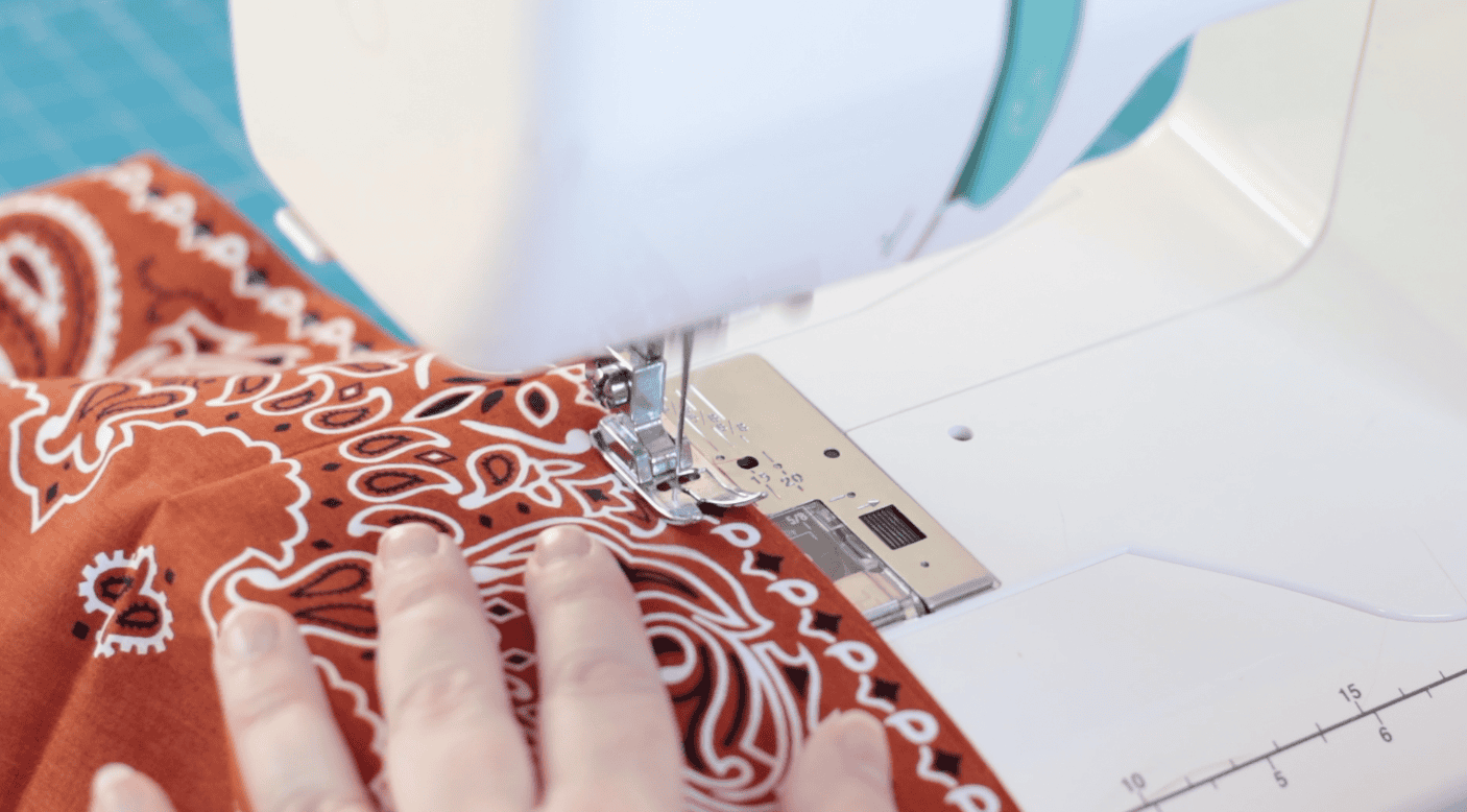 Sewing machine stitching fabric.