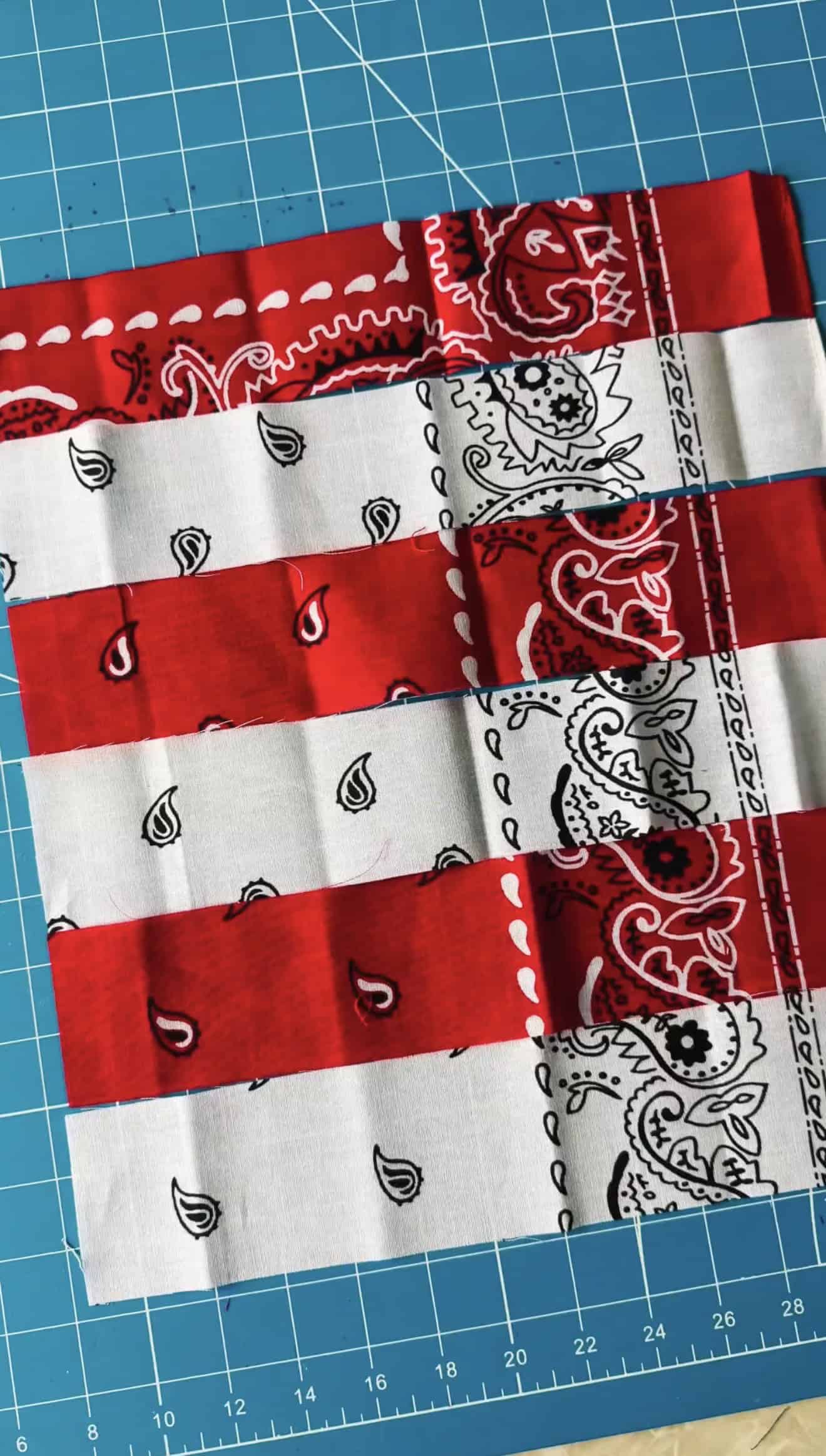 Red and white strips of fabric sewn together.