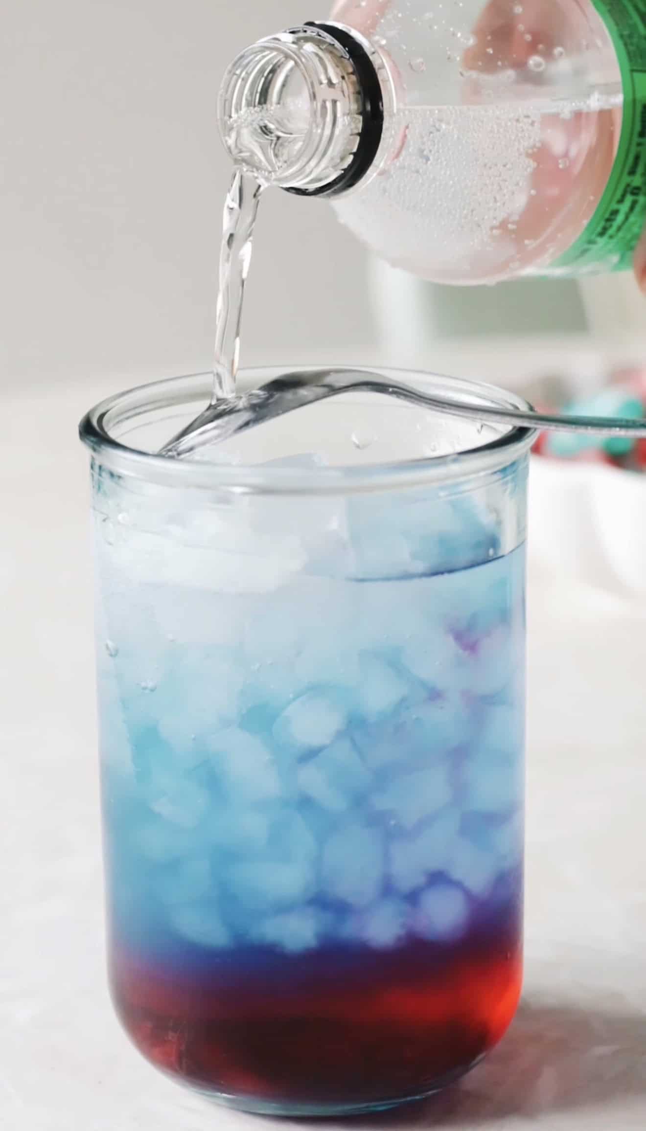 Sprite poured over blue layer of punch.