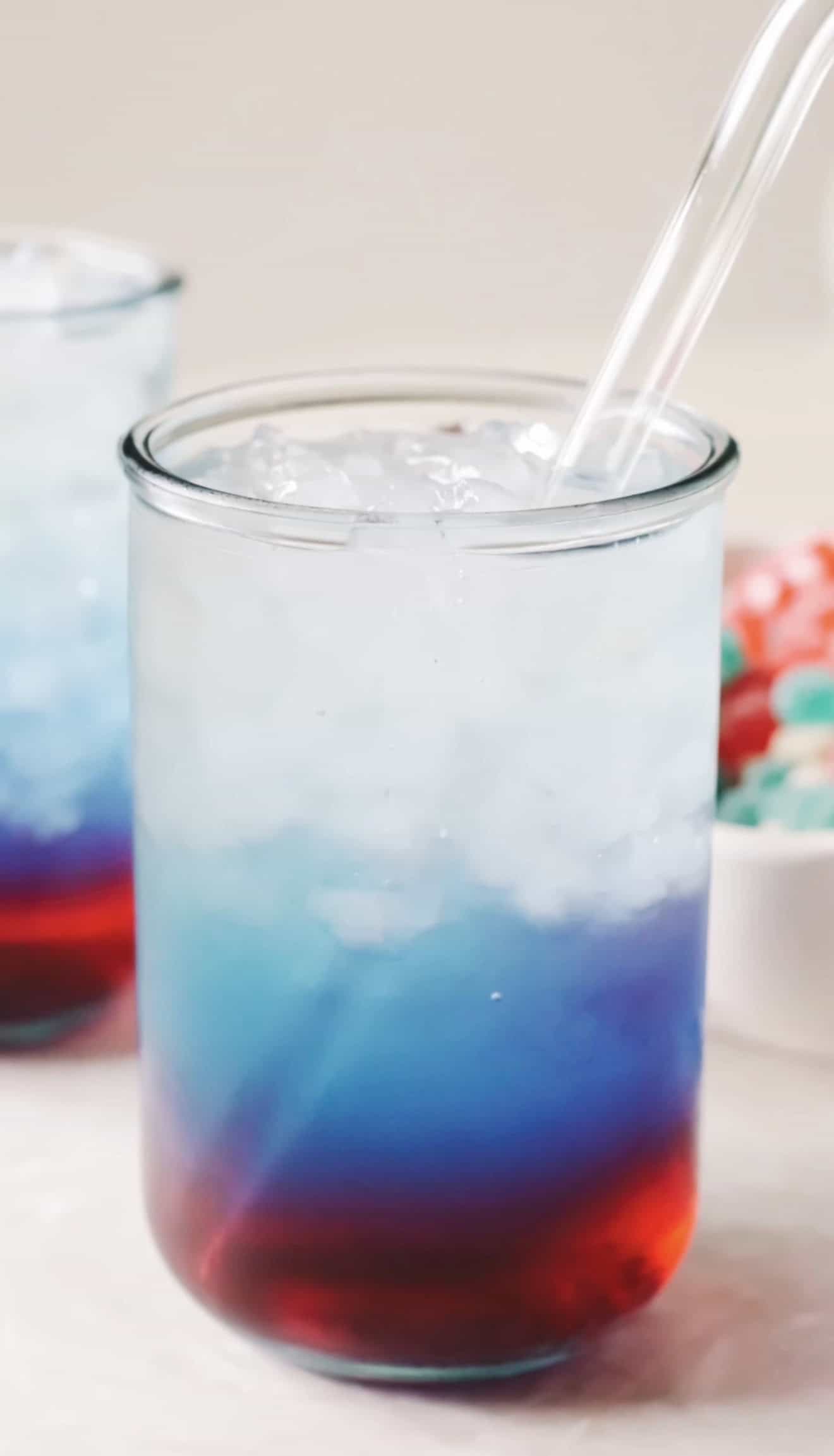 Glass of punch with straw.