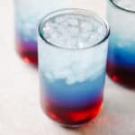 Red white and punch in glass with ice.