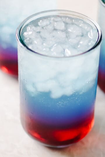 Red white and punch in glass with ice.