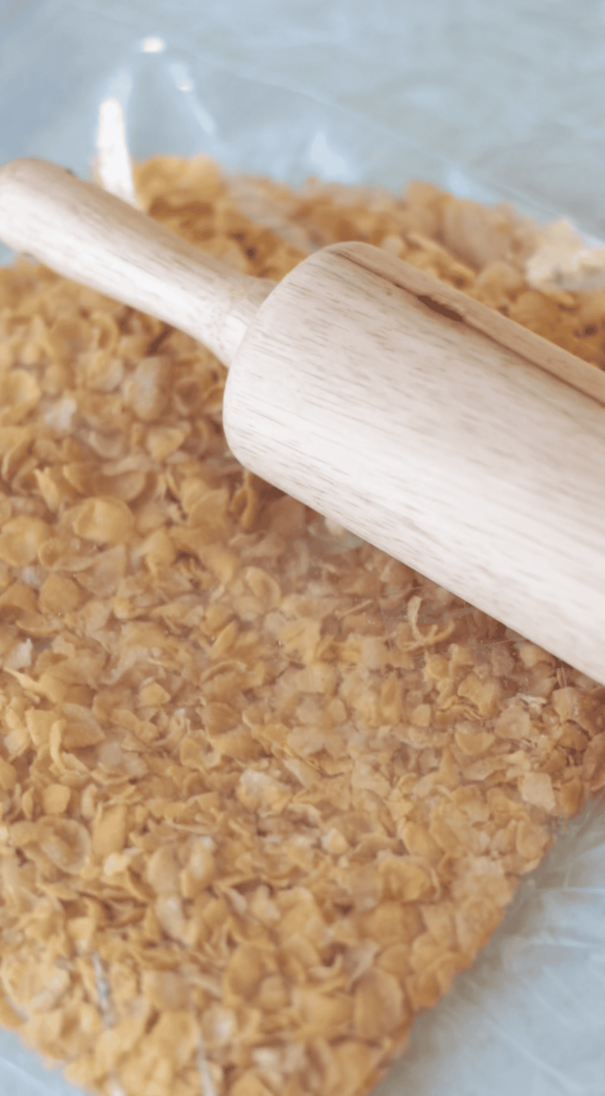 Rolling pin crushing corn flakes.