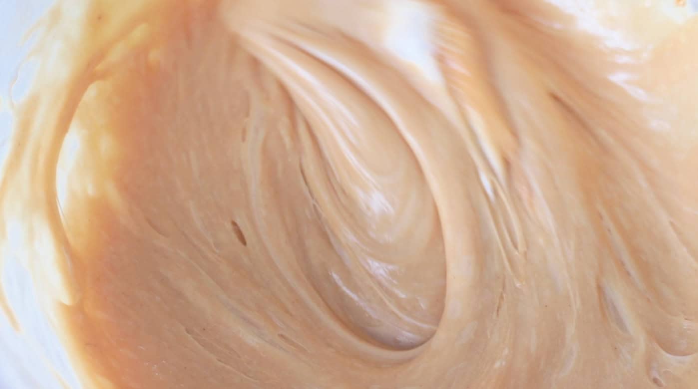 Melted marshmallows, peanut butter and butter mixture in bowl.