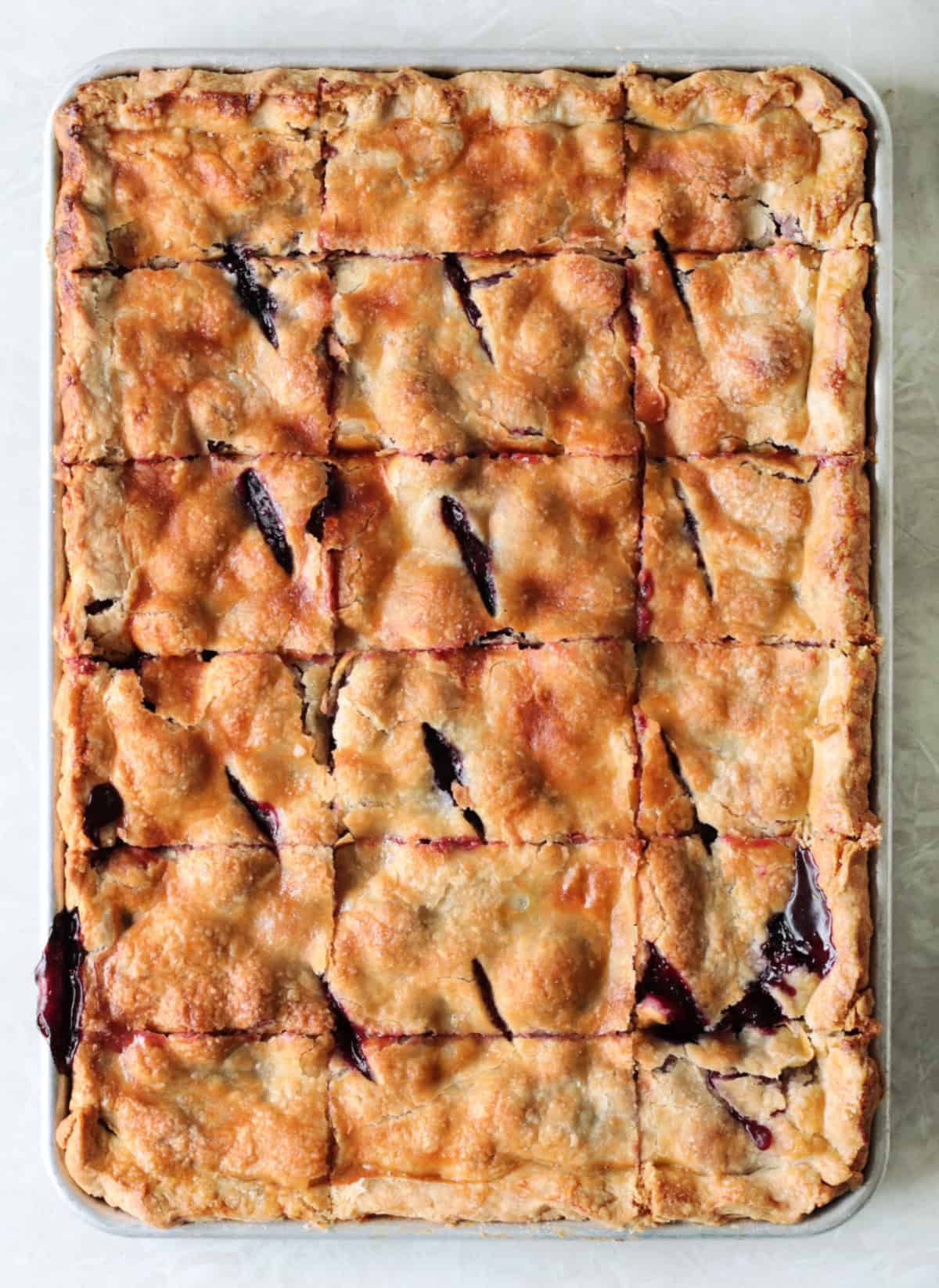 Pan with baked mixed berry slab pie.