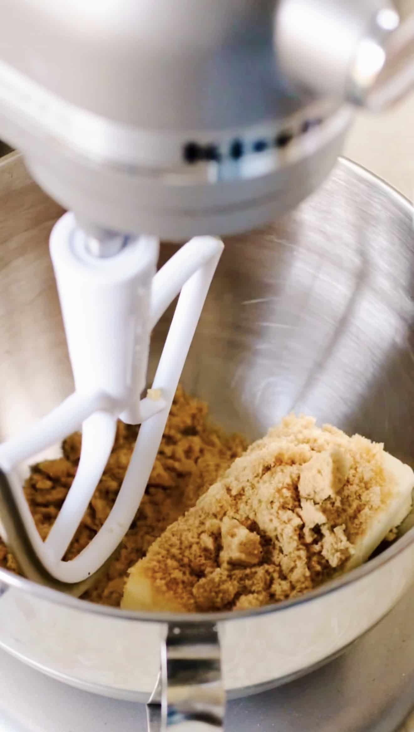 Stand mixer bowl with butter and brown sugar.
