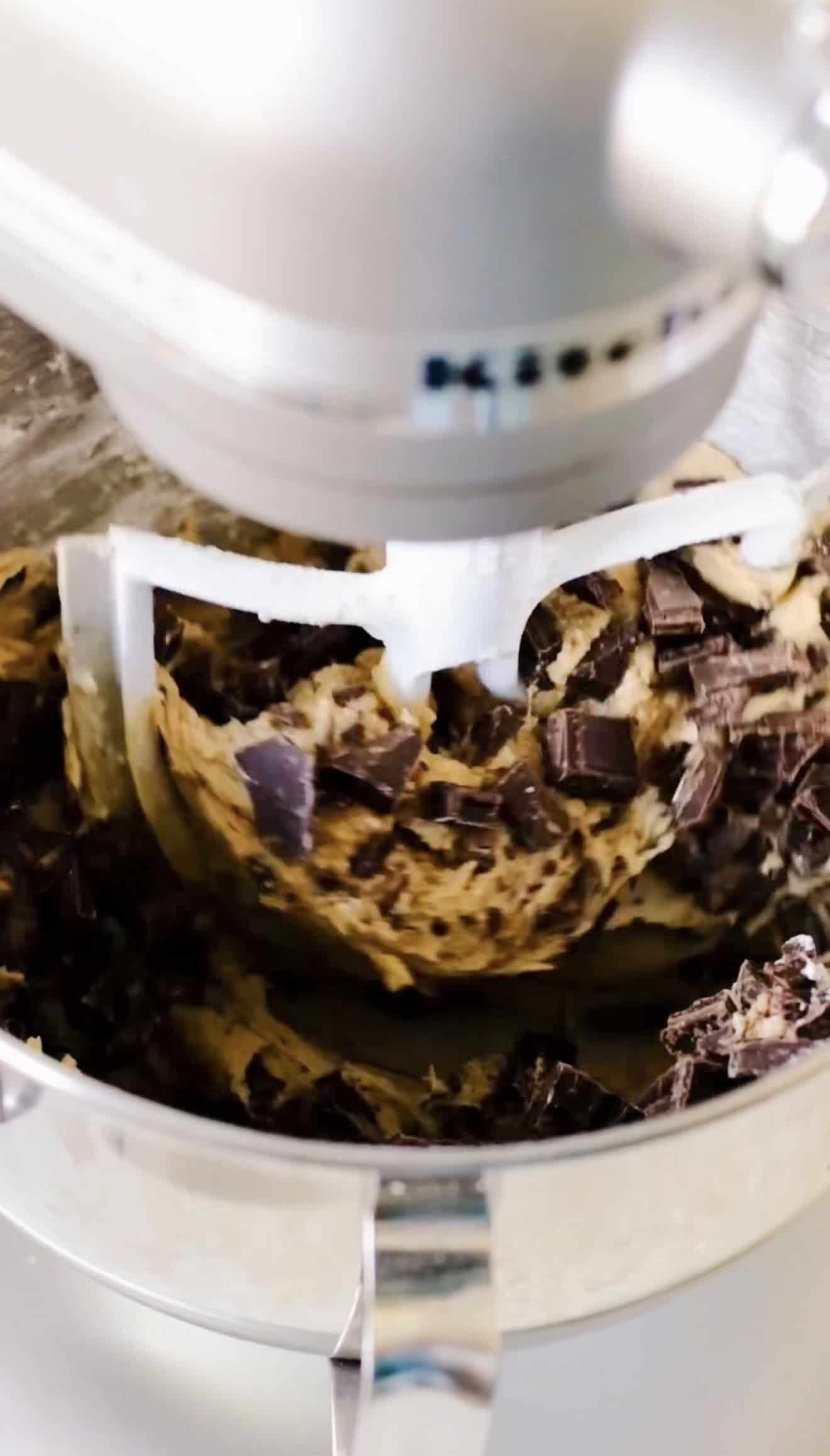 Stand mixer with chocolate chunk cookie dough.