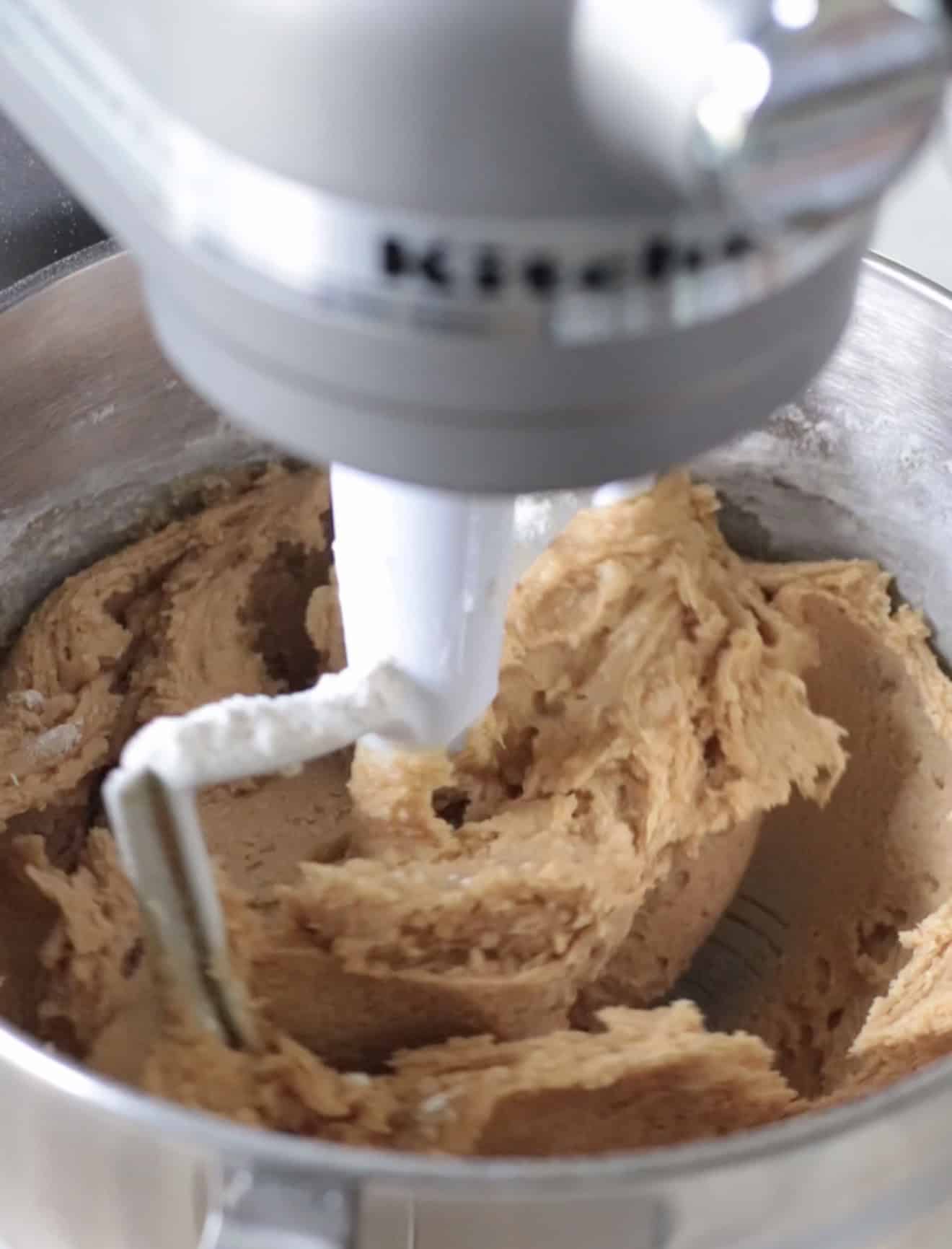 Stand mixer bowl with peanut butter cookie dough.