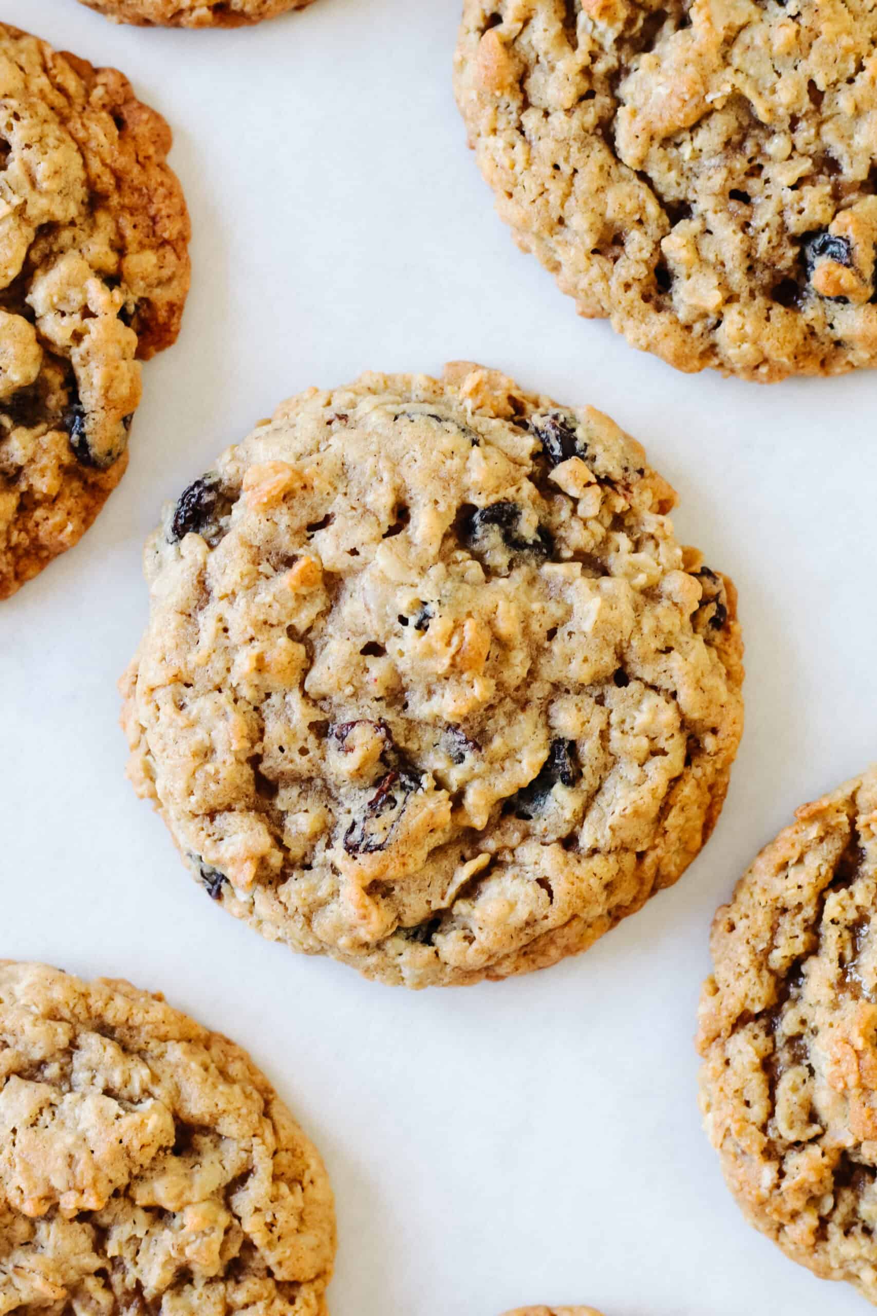 Oatmeal raisin cookies on parchment paper.