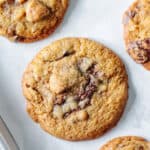 Chocolate chunk cookies on a baking sheet.