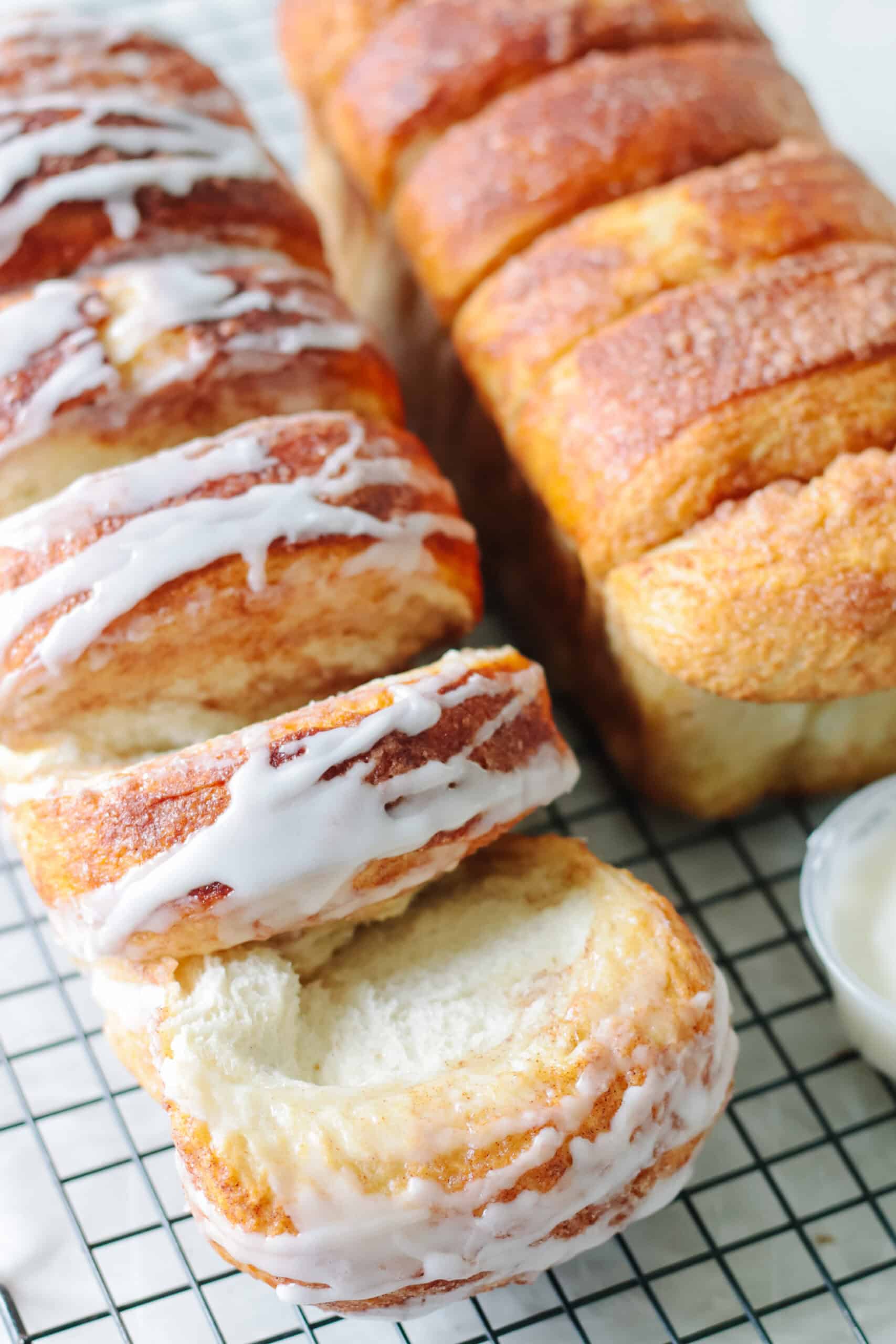 Two loaves of Dollywood bread, one with icing, one without.