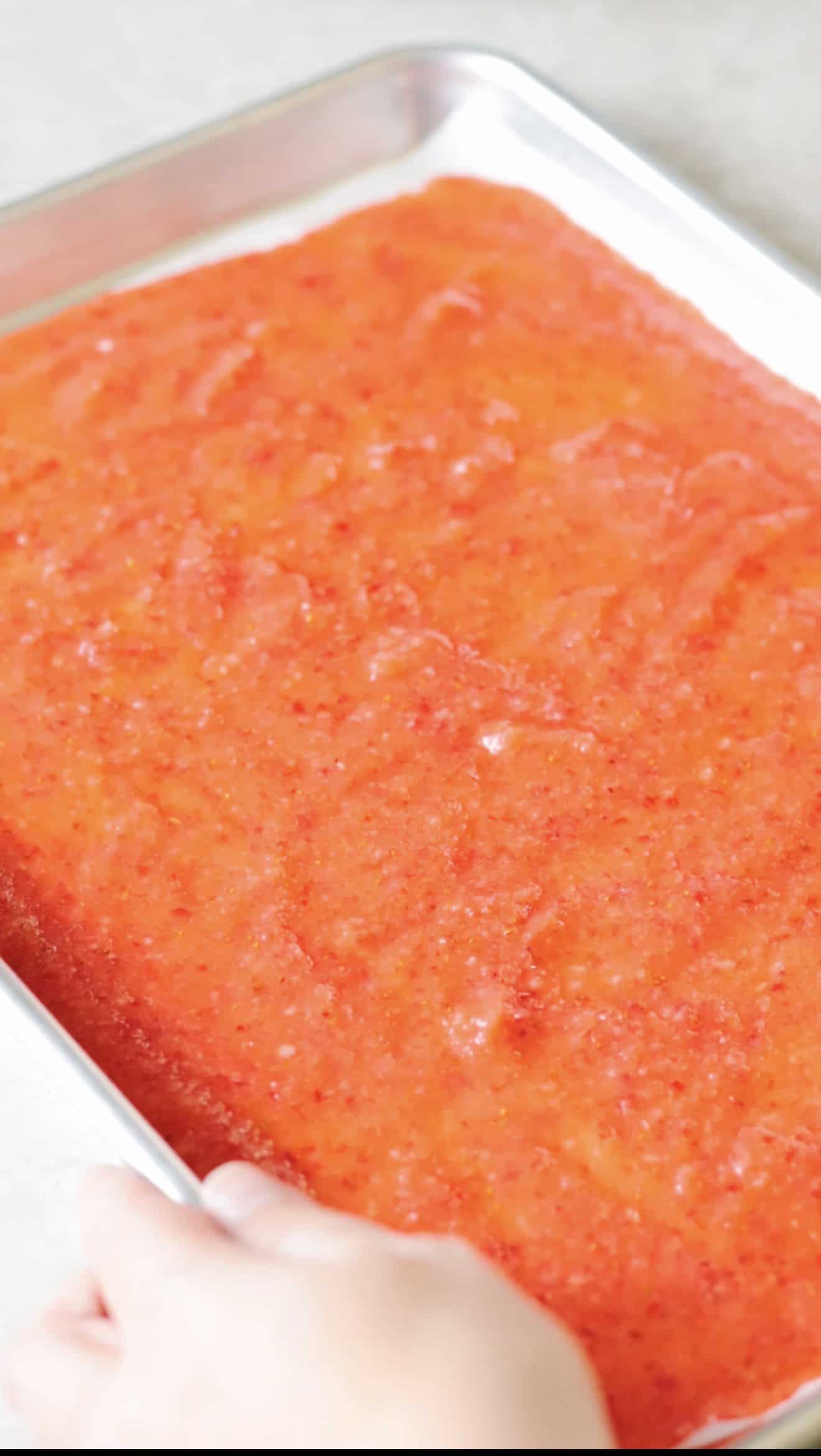 Baking sheet of strawberry fruit leather puree.