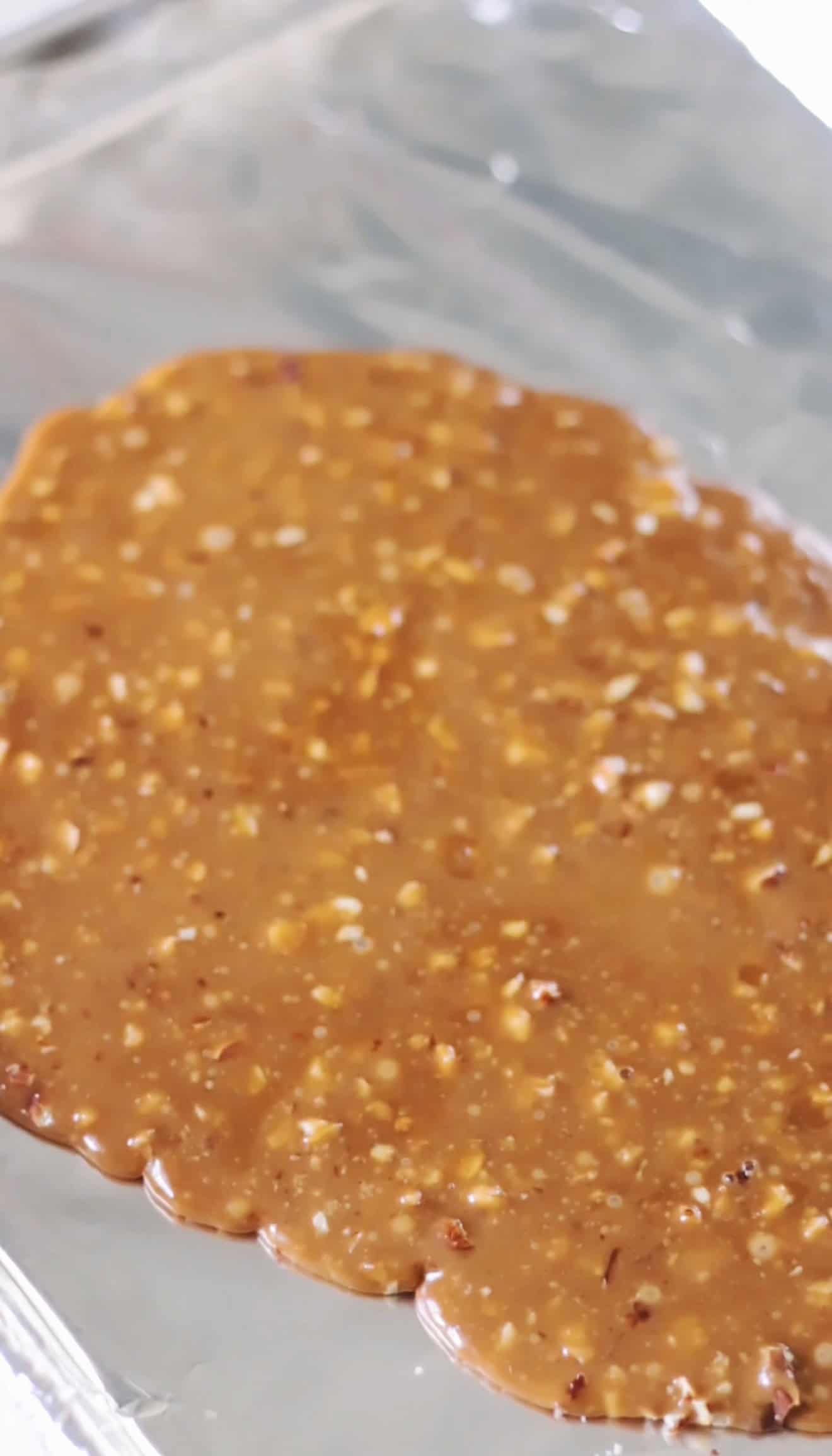 Hot toffee poured onto a foiled lined baking sheet.