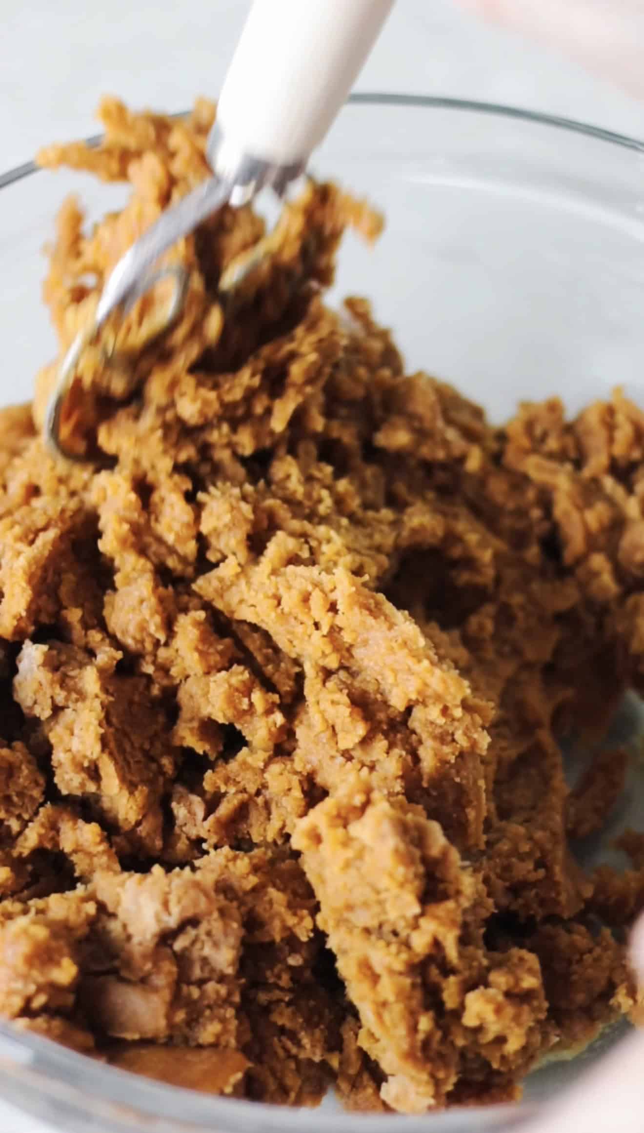 Mixing bowl of molasses cookie dough.