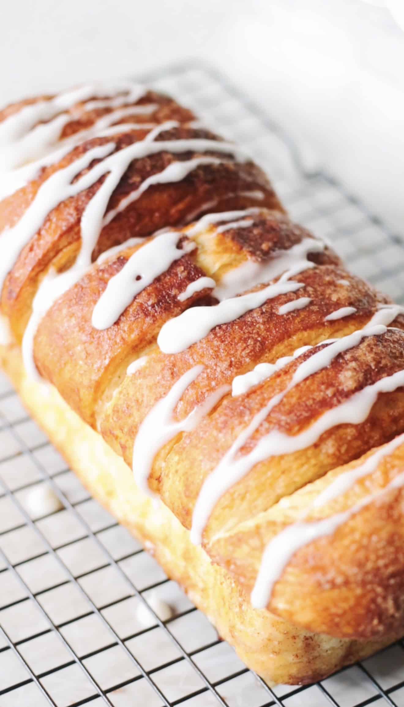 Copycat Dollywood bread with glaze on cooling rack.