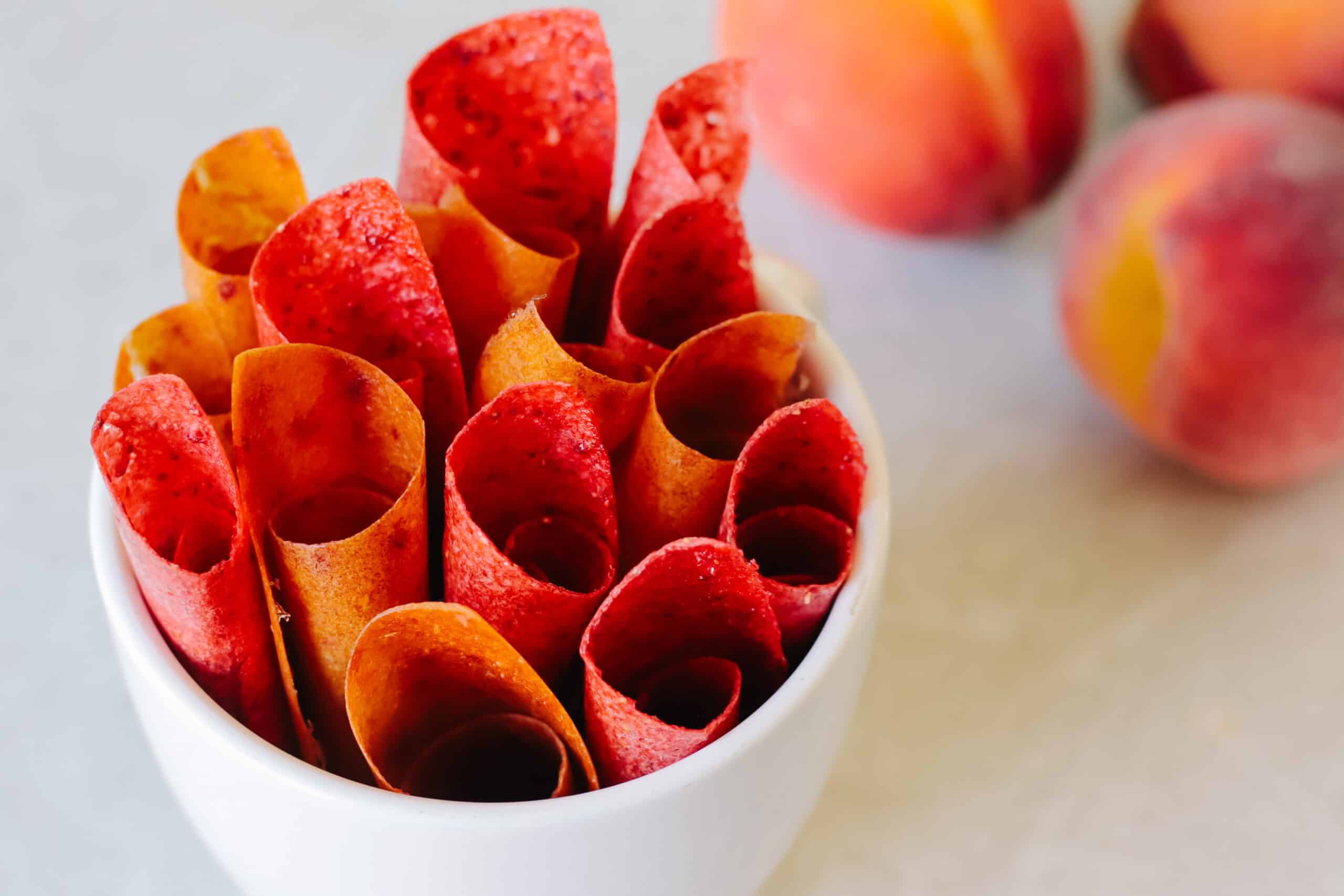 Cup of rolled up fruit leather.