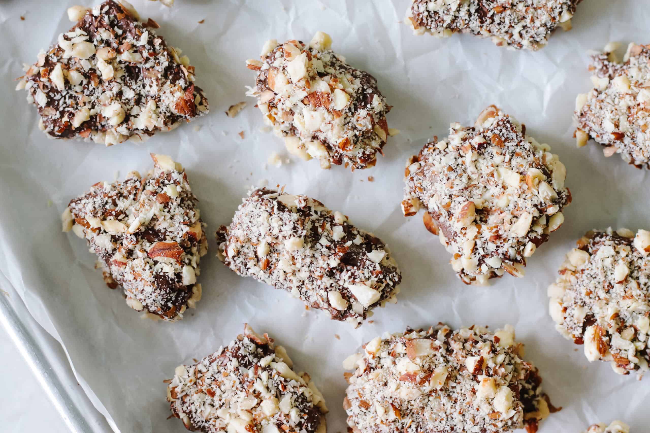 Almond roca on baking sheet lined with parchment paper.