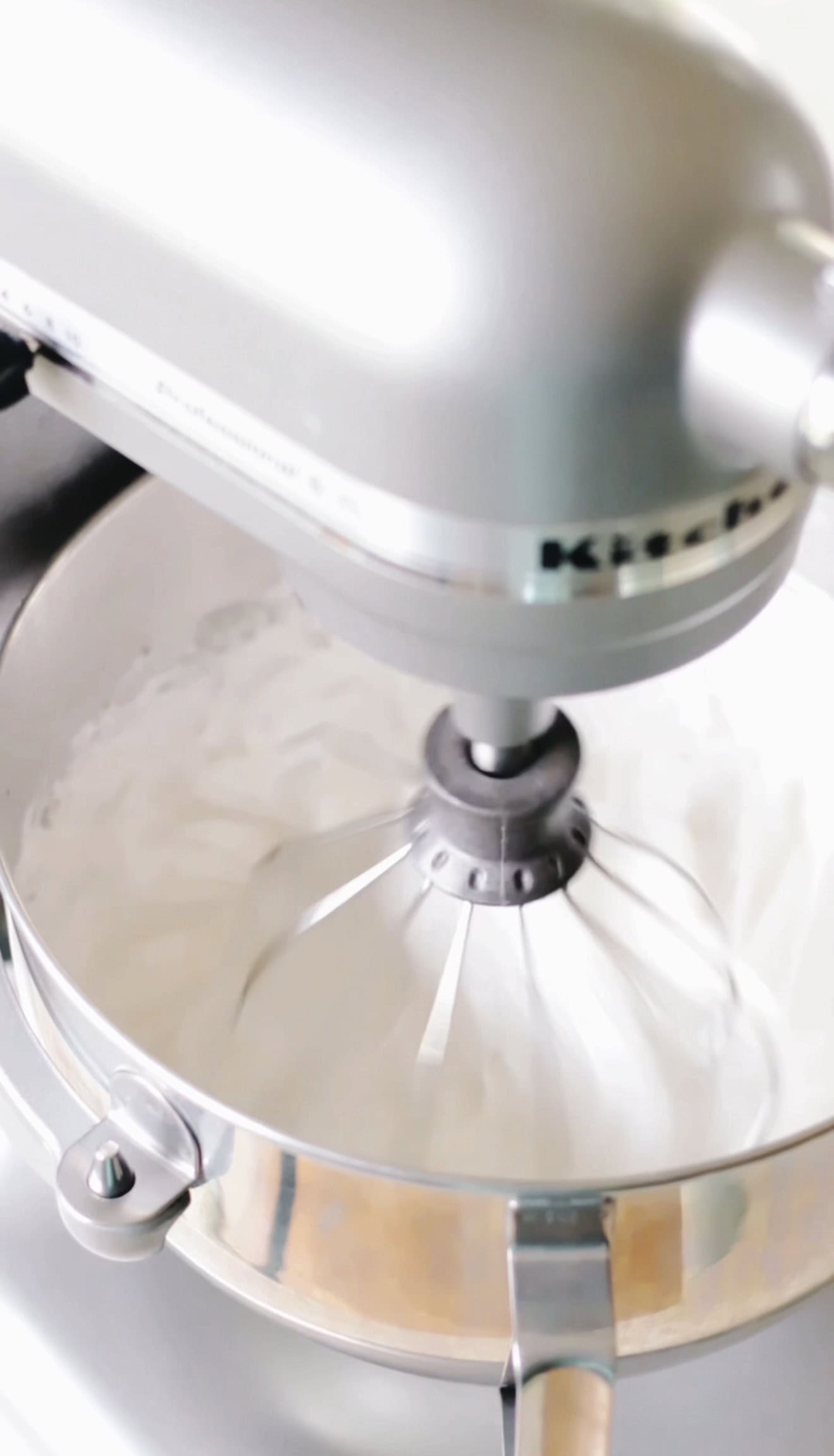 Electric mixer beating marshmallow mixture.