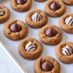 Gingerbread blossoms baked on cookie sheet.