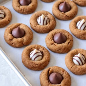 Gingerbread blossoms baked on cookie sheet.